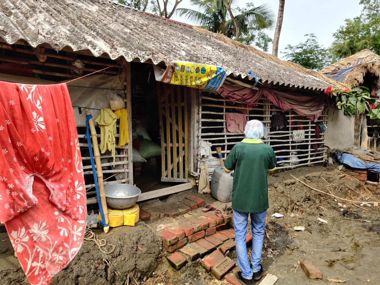Hindol volunteer walking near rural homes