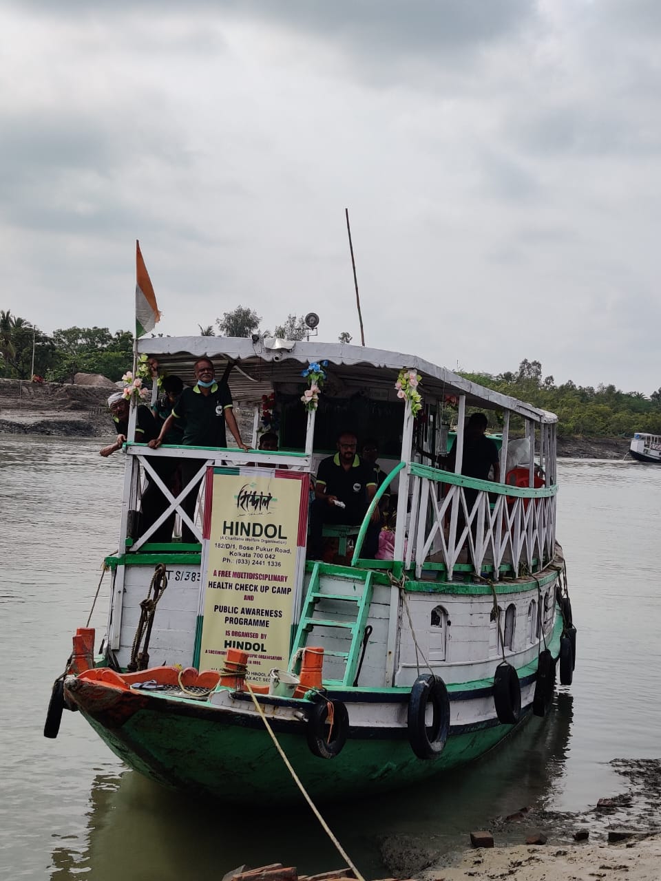 Hindol team traveling by boat for community outreach